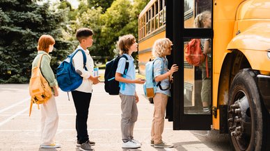 Children lining up for school bus